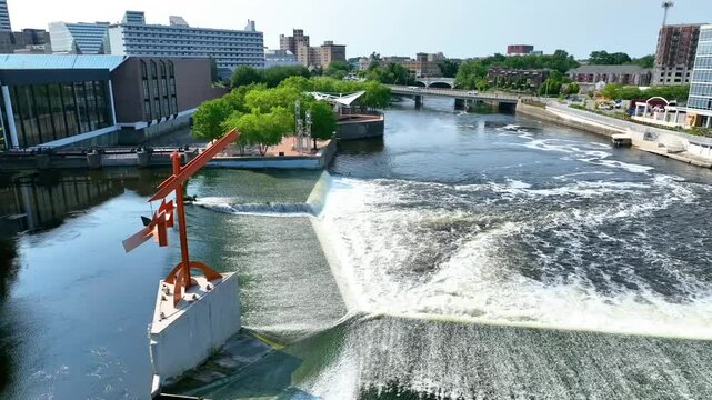 Aerial View of South Bend Riverfront with Waterfalls and Modern Architecture
