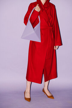Woman Wearing Red Coat with Stylish Purple Handbag