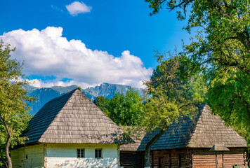 Traditional farming village in Bran, Transylvania, Romania. The Southern Carpathian mountains can be seen in the background