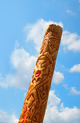 Old wooden idol in the field