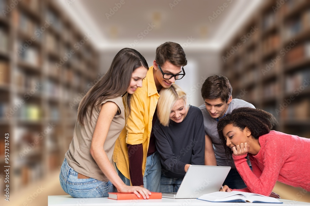 Wall mural Happy students friends learning in library for education