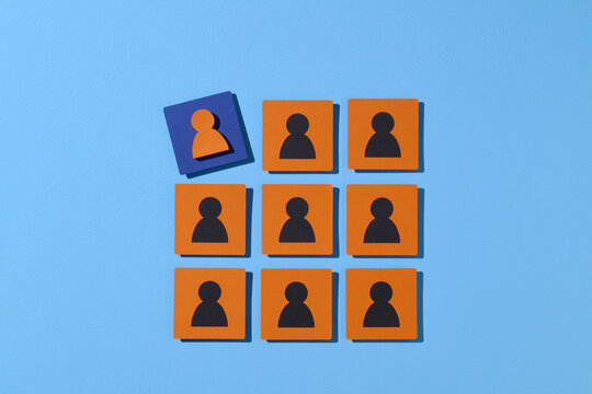 Unique Person Among Group of Identical Figures