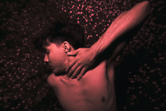 Sensual man portrait in red light