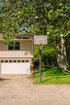 Home Exterior Driveway and Basketball Hoop