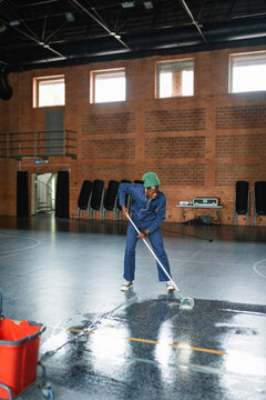 A man washes the floor