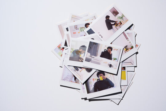 Instant Photos of a Man Working at a Desk