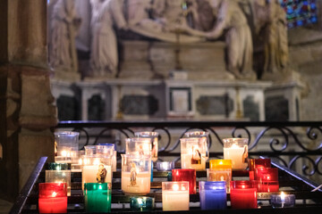 Colorful offering candles inside a church
