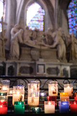 Colorful offering candles inside a church