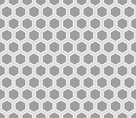 Honeycomb hexagons background. Gray color on matching background. Hexagon mosaic pattern with inner solid cells. Seamless pattern. Tileable vector illustration.