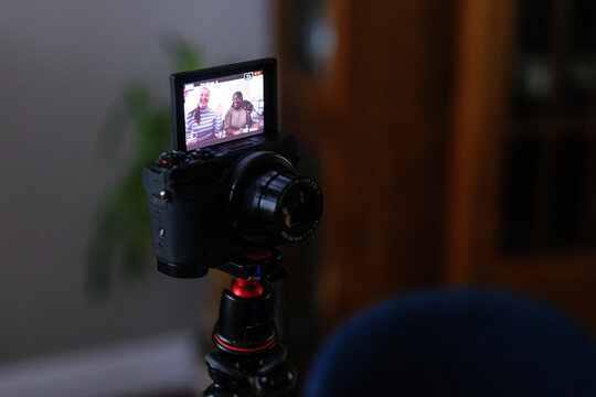 Close-up of camera filming podcast of two plus-size women