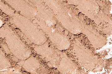 Crushed tan colored facial loose powder texture background. Top view