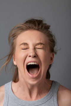 Woman Screaming with Eyes Closed
