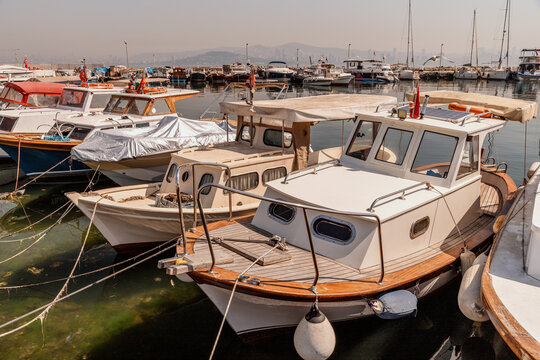 Boats Docked at Marina on Sunny Day

