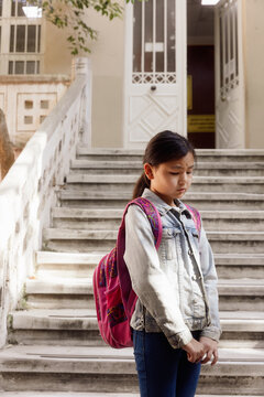 11 year old girl on the school porch