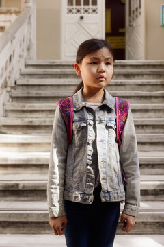 11 year old girl on the school porch