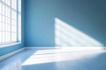 Obraz premium Bright sunlight streaming through large windows in a calm blue room during the afternoon