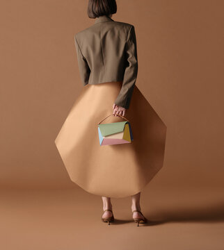 Fashion Model Holding a Colorful Handbag with Geometric Shape