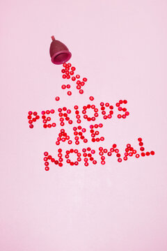 Menstrual cup & period blood illustrative text "periods are normal"