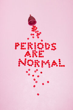 Menstrual cup & period blood illustrative text "periods are normal"