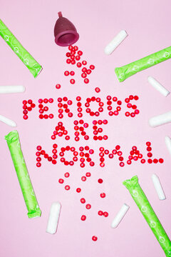 Menstrual cup & tampons with illustrative text "periods are normal"
