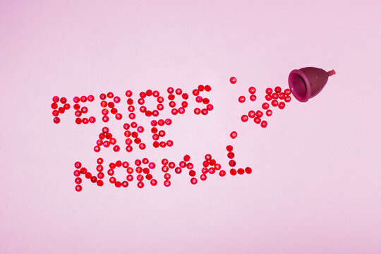 Menstrual cup & period blood illustrative text "periods are normal"