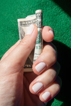 Holding a twenty dollar bill closeup