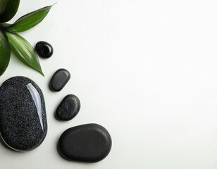 Tranquil Spa Setting: Flat Composition with Stones on White Background
