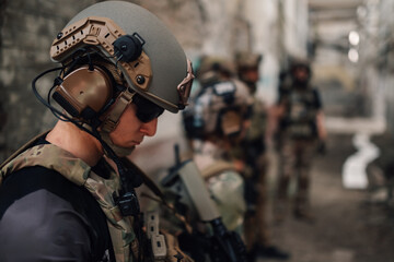 Close up of airsoft player with helmet on head preparing for action.