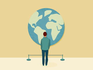 Person watching large world globe in exhibition