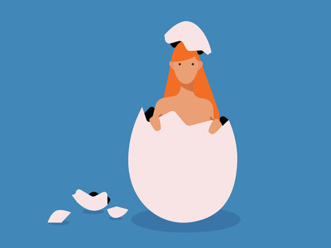 Woman emerging from hatched egg in blue studio