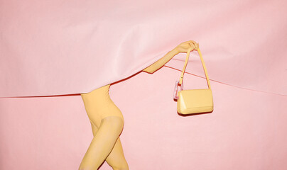 Creative Fashion Concept With Pink Background And Yellow Outfit