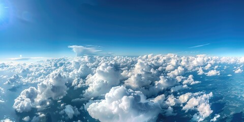 Naklejka premium Awe inspiring aerial perspective of vast land and sky captured from a height of a thousand feet amidst billowing white clouds Smartphone photo