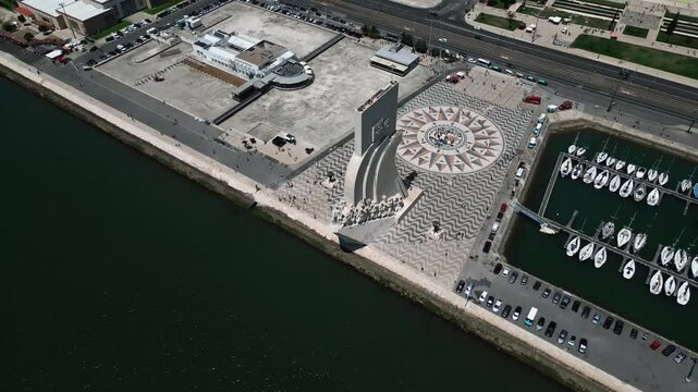 Urban aerial video above the marina and city of Lisbon on the coastline, Portugal