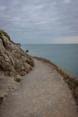 Howth, Ireland - June 18 2024 "Howth Cliff walk trail during the cloudy morning"