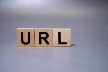 Letters abbreviation url www on wooden cubes, on a dark background, light wooden cubes signs,