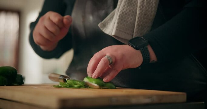 Hands, wrist pain and man in kitchen, cutting and chef with inflammation, muscle tension and injury. Closeup, person and professional with ingredients, home and emergency with fracture or health risk