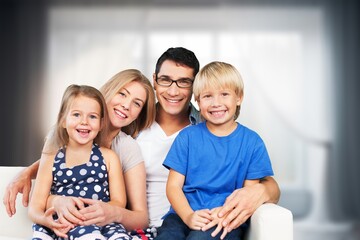 Obraz premium Happy young family posing together at home