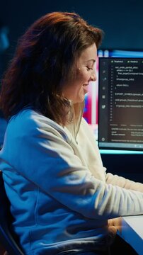 Vertical video Happy admin in home office satisfied after futureproofing company network from downtimes and unexpected system failures. Smiling IT expert pleased after managing to increase data