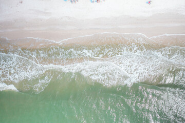 ocean waves calmingly rolling onto sandy beach
