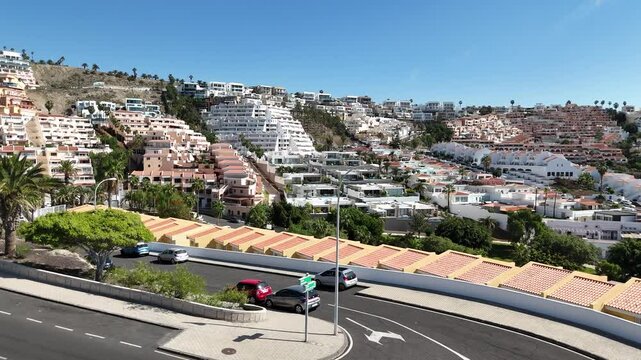 Panoramic shot of Costa Adeje city in Tenerife showing beautiful low-rise expensive townhouses build on the mountain.