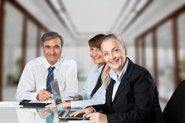 Two busy business people at work in office