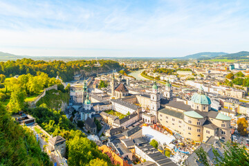 Fototapeta premium View of the old town, new town and Salzach River from the medieval Fortress Hohensalzburg hilltop castle on a summer day in Salzburg, Austria.