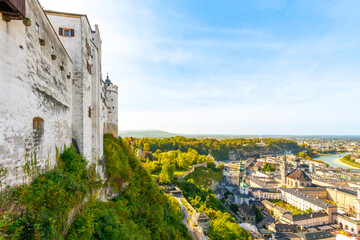 Obraz premium View of the old town, new town and Salzach River from the walls of the medieval Fortress Hohensalzburg hilltop castle on a summer day in Salzburg, Austria.