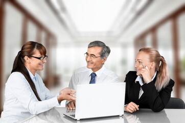 Two busy business people at work in office