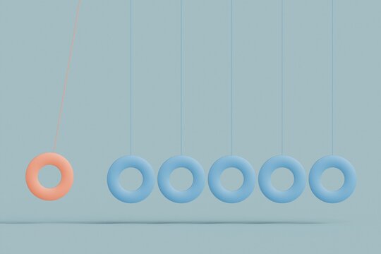 Newton's cradle with a single pink ball