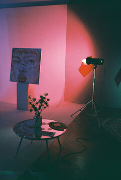 Art exhibition scene with pink strobe light