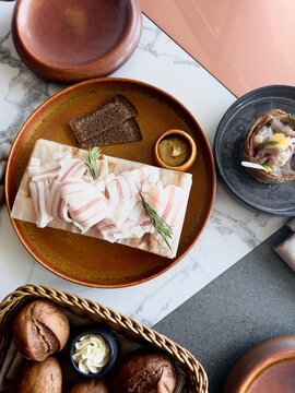Lard, bread with butter and mustard on the table 