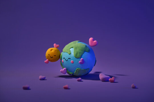 Cute planet Earth and Moon hugs of funny green planet with clouds