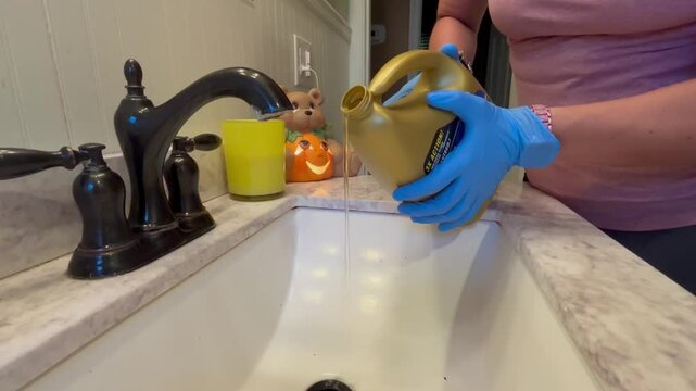 Using liquid plumbing blog removal fluid on a bathroom sink - Normal Color -
