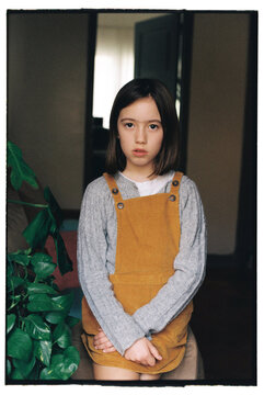 Portrait of a 9 year old girl on the couch at home